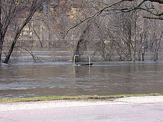 looking out into the merging rivers, a 2 person swing stands submerged 4/14/01