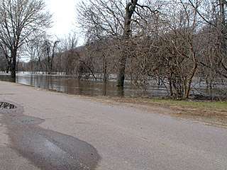 looking out into the Minnesota River, water is inches from flooding the road 4/14/01